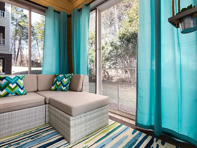 Private Screened-In Sunroom with Cozy Seating and Serene Outdoor Views - Diamond Interior