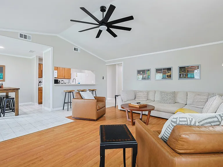 Unwind in a spacious, open-concept living room featuring plenty of comfortable seating meaning there is room for everyone to relax and make lasting memories together.