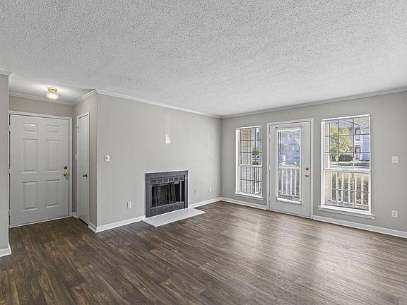 Enjoy indoor-outdoor living with cozy fireplace and sliding glass doors to your patio, professionally operated by Highlands Vista Group.