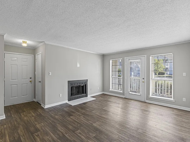 Enjoy indoor-outdoor living with cozy fireplace and sliding glass doors to your patio, professionally operated by Highlands Vista Group.
