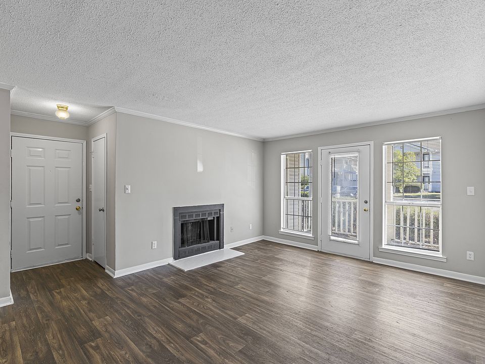 Enjoy indoor-outdoor living with cozy fireplace and sliding glass doors to your patio, professionally operated by Highlands Vista Group.