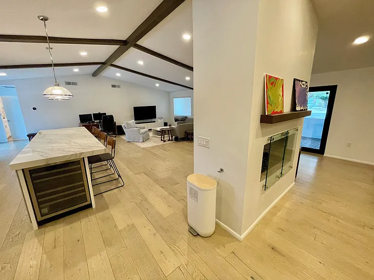 Fireplace, front door, kitchen, living room