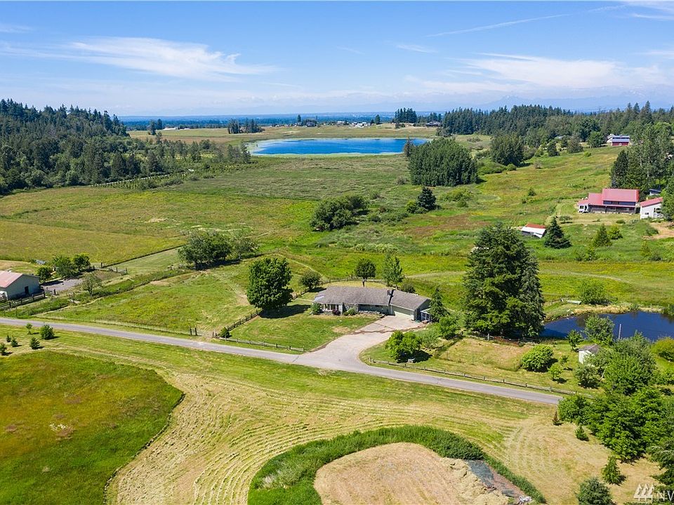 Home overlooks Squalicum Lake, pond and surrounding hills. Shop is included in this property.