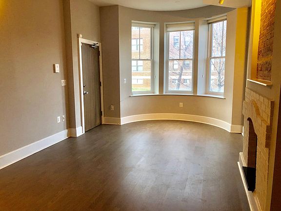 High ceilings and wide plank hardwood floors throughout