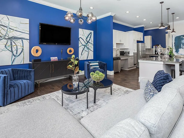 Stylish resident lounge with modern decor, open-concept layout, and entertainment spaceperfect for relaxing and socializing in Charlotte apartment living.