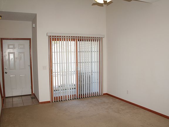 The large livingroom has a sliding glass door and gas fireplace