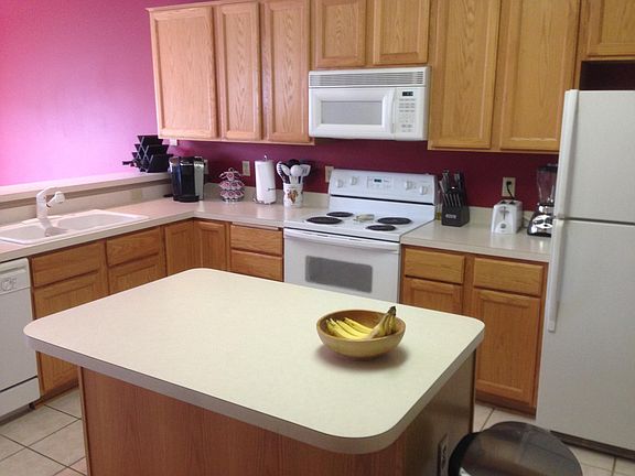 Open kitchen with ample cabinet space, large pantry and countertops. Coat closet as you first walk in from garage door with 1/2 bath.
