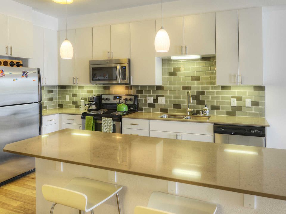 Kitchen with Island and Stainless Steel Appliances