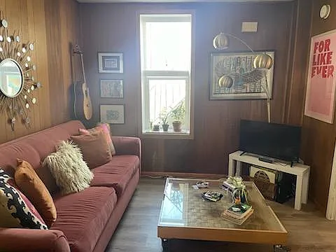 Living room. Same view, but newer flooring, different tenant.