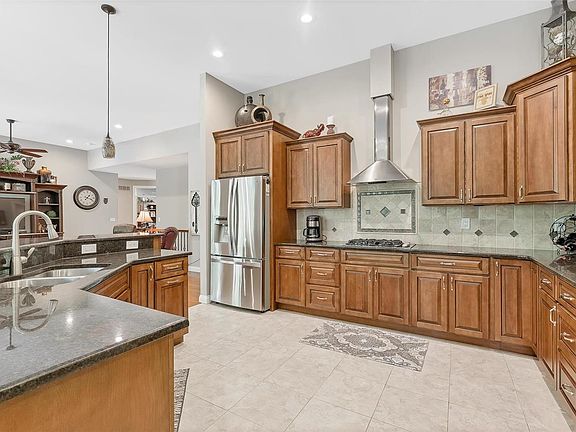Chef's delight kitchen with Bosch upgraded stainless steel appliances.  Staggered cabinets and solid surface counters.