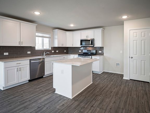 Eat-in bartop island in kitchen.