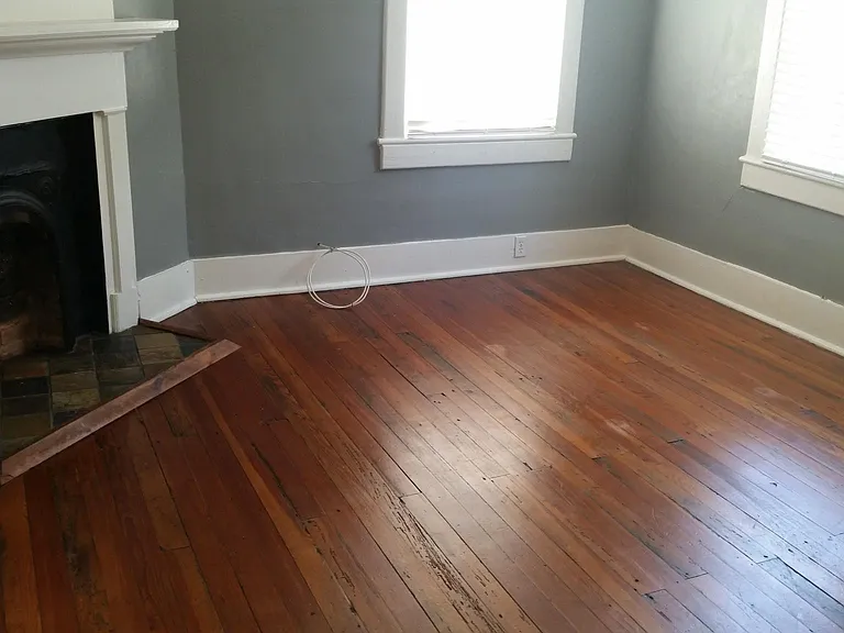 Back Bedroom - Original hardwood floors, Levolor blinds, decorative fireplace, & ceiling fan with light.