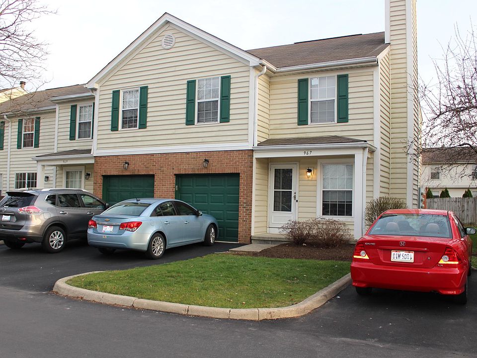 Front of the unit. The condo includes a one-car garage (pictured on the right).