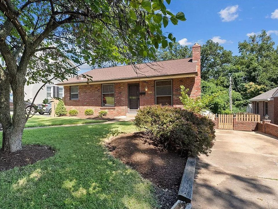 Outside with large driveway