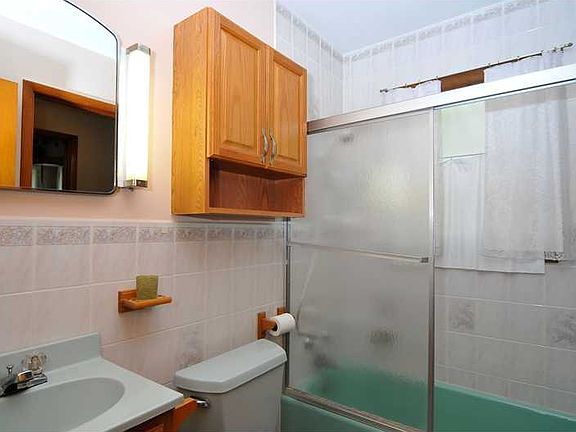 Enter full bath from hallway or close to back door.