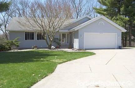 Steet View
						:
						Front view with white pines on sides of home