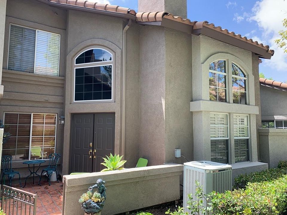 Front entry with brick gated patio. Two story townhouse, master bed/bath and loft on second level.