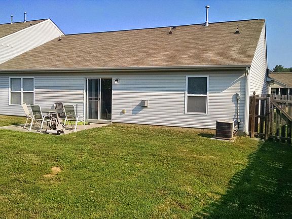 Fenced backyard with patio