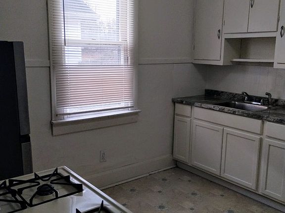 Countertop, sink & cabinets.