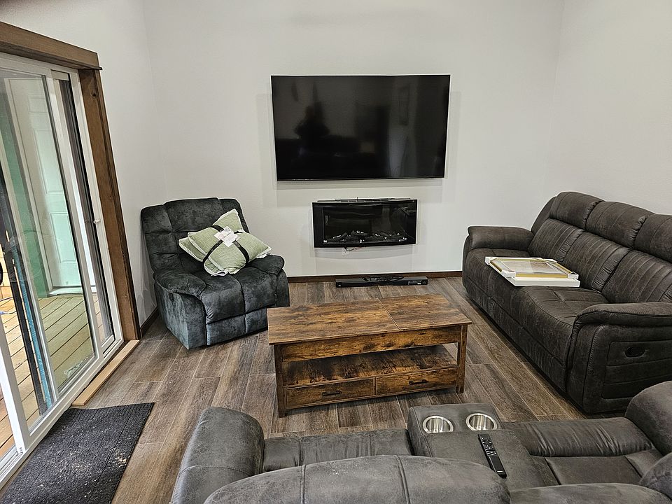 75" Smart TV. Fireplace. Loveseat, couch, recliner.