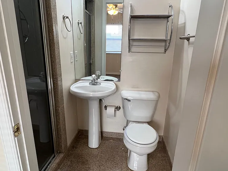 Ensuite bathroom with tile shower.
