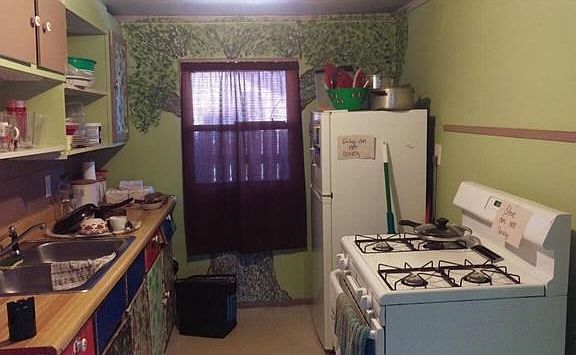 Galley kitchen with artistic finish out.