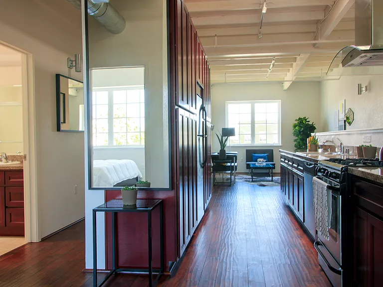 Kitchen Gally - hallway to Bathrooms and Bedrooms - Skylight in Kitchen and track lighting throughout unit