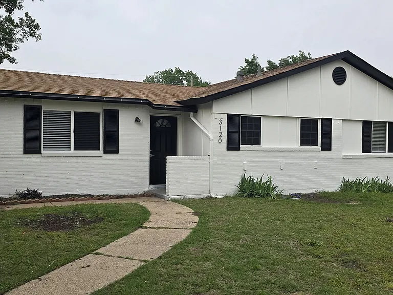 front view of home, fresh paint, and driveway for 2 vehicles