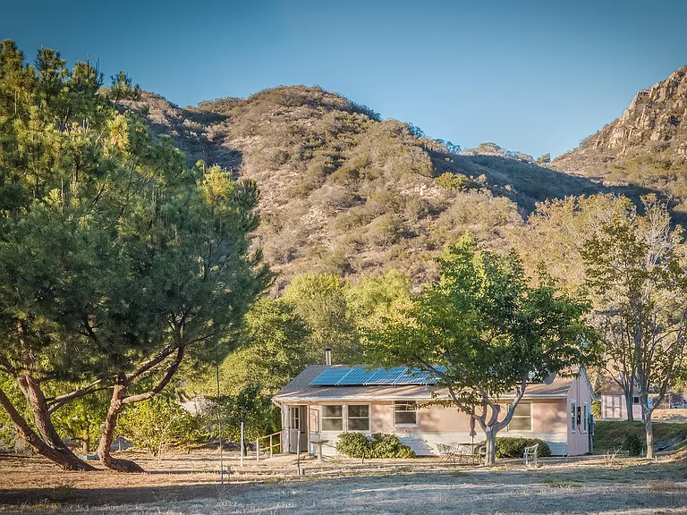 Nestled under Calabasas Peak (upper right).