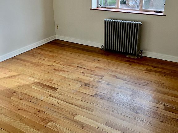 Hardwood floors in the bedroom. Lots of privacy. New blinds in every window!