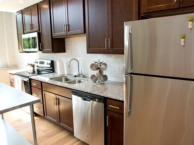 Kitchen with espresso cabinets and stainless appliances