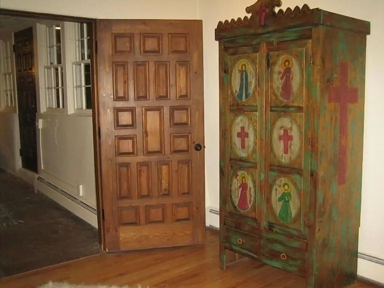 Folk art trastero in living room.