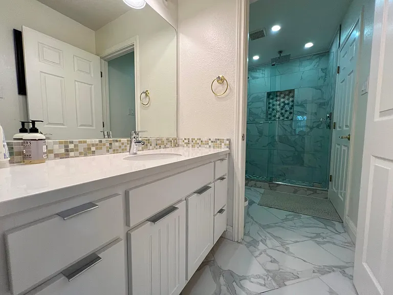 updated bathroom and shower with dual rainshower heads