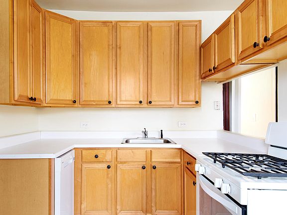 Kitchen With Ample Cabinetry & Counter Space, Dishwasher, Oven With Continuous Grill Over Cooktop