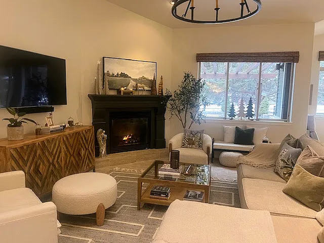 Living room with previous tenants' furnishings.
