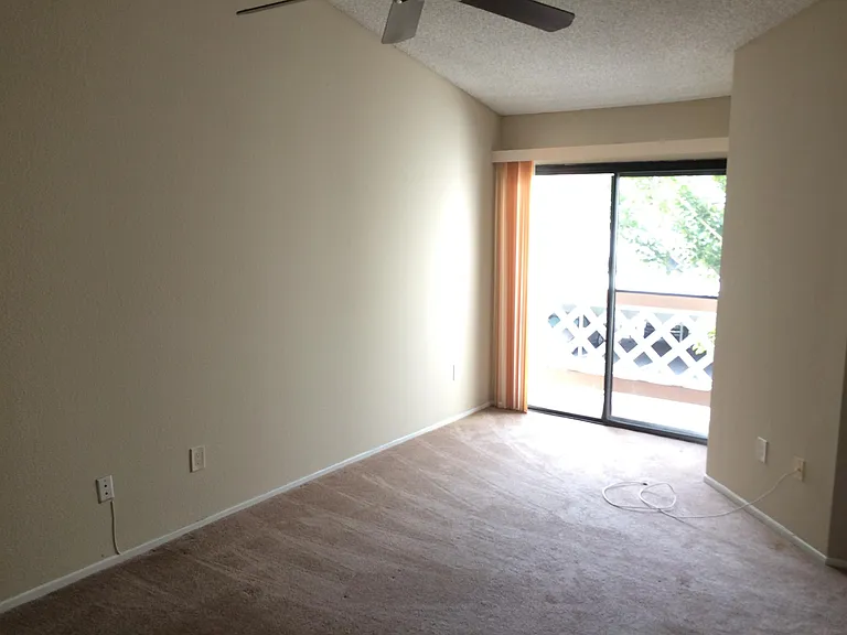 Large and bright master bedroom with ceiling fan