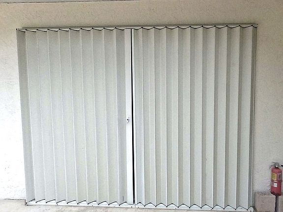 Built in hurricane shutters