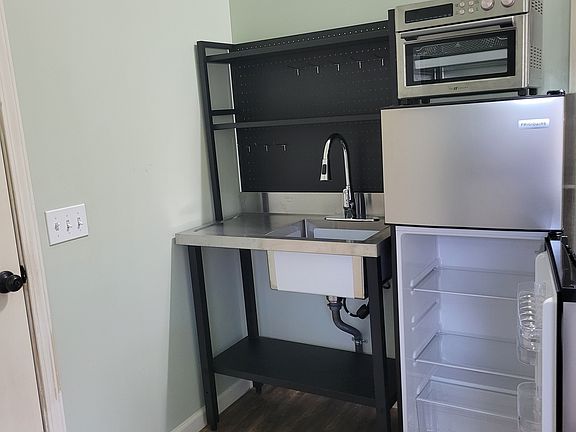 Brand new refrigerator and large convection oven that air-fries and dehydrates. Extra shelf space above sink.