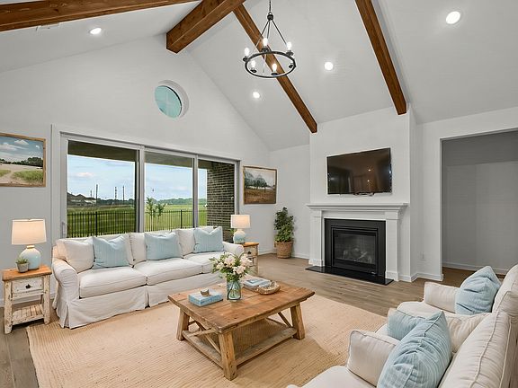 Great room with vaulted ceiling stained ceiling beams