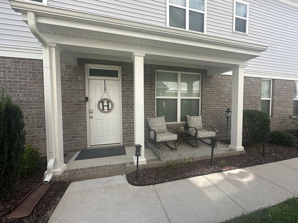 Side entrance with covered front porch.