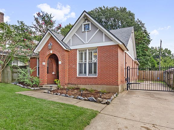 Custom English cottage provides the best of both worlds- new construction with historic charm. A driveway with automatic iron gate provides additional security.