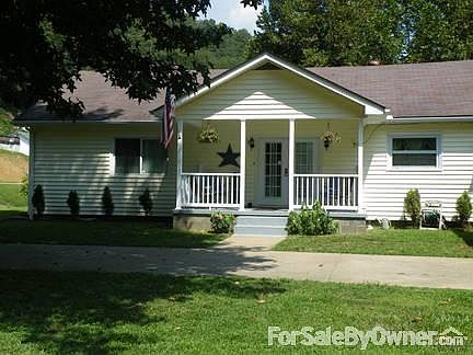 Cozy Front Porch
						:
						Large tree provides lots of shade for hot summer days