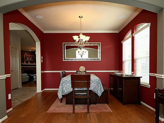 Entertain in your formal dining room with hardwoods, bold paint & crwn molding