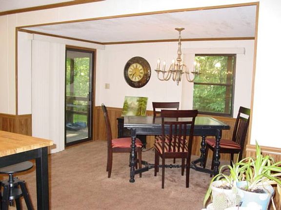 Nice dining area with a door leading out to the back deck.