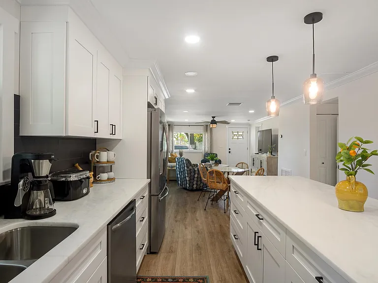 Granite countertops and cabnets filled with everything you need in your kitchen.
