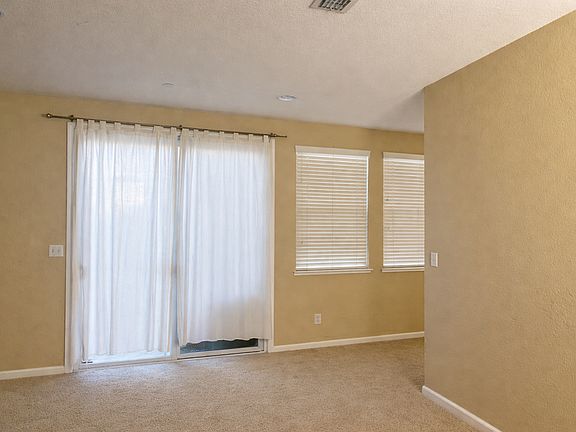 side patio from the kitchen/family dining area to driveway