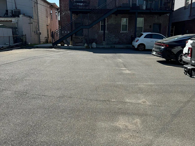 24x7 Secure off street parking. Security cameras in front and back of building.