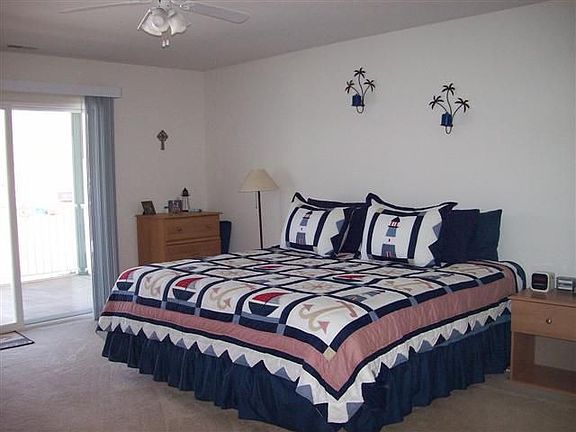 Master Bedroom, large room, sliders go to screened, covered deck