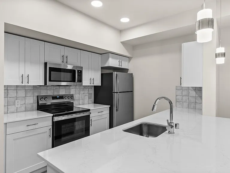 Modern kitchen + island living for easy cooking and gathering Modern kitchen + island living for easy cooking and gathering
