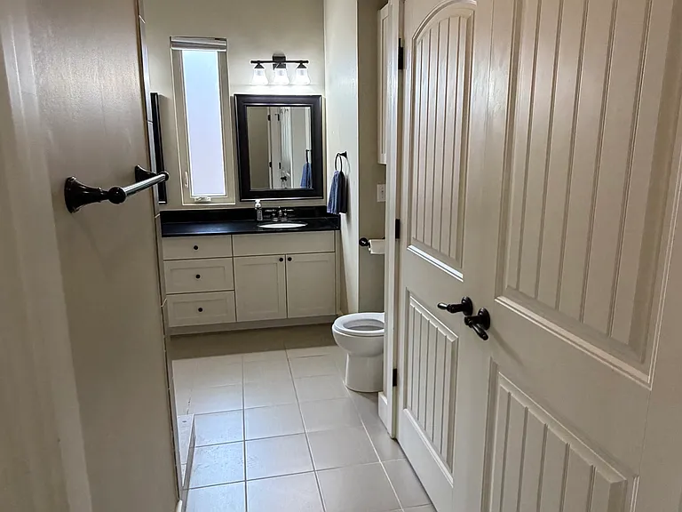 Primary bathroom, laundry to the right/behind the doors (2nd Floor)